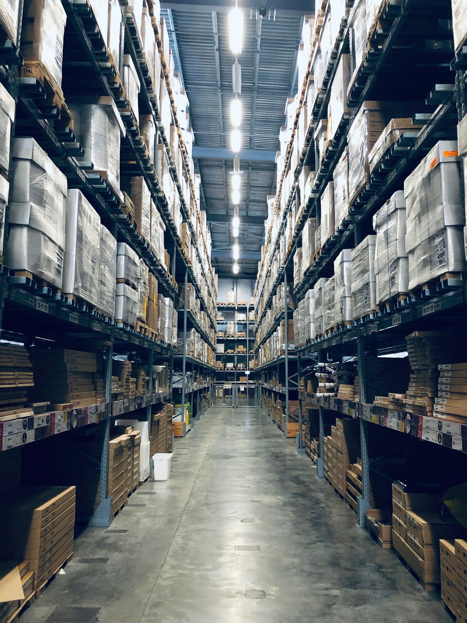 Warehouse distribution aisle — representing the industries JULIOBAM serves